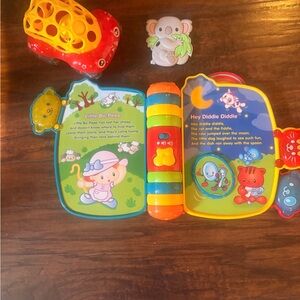Colorful Interactive Storybook, toy truck and teether included.